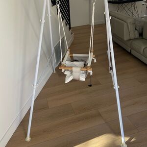 White Baby Swing with Wooden Accents